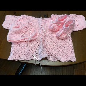 Crocheted layette set.